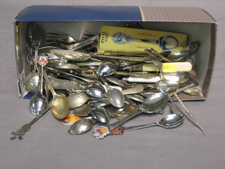 A collection of souvenir spoons etc