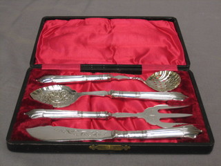 A silver plated tea serving set comprising sifter spoon, jam spoon, break fork and butter knife, cased