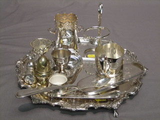 A circular silver plated salver with bracketed border 12" and a small collection of plated items