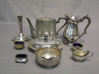 A circular silver plated muffin dish and cover, a Britannia metal teapot, a hotwater jug and a small collection of plated items