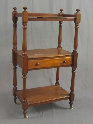 A Victorian mahogany 3 tier what-not with three-quarter gallery fitted a drawer and raised on turned and block supports 23"