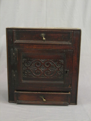 A 17th/18th Century oak hanging cupboard fitted 2 drawers, flanked by 2 long drawers 23" (heavily wormed)