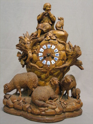 A 19th Century French 8 day striking timepiece with porcelain dial contained in a Bavarian carved walnut? case in the form of an outcrop with sheep and seated shepherd with dog 22"