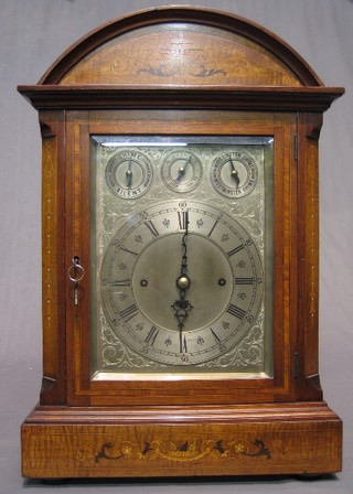 A handsome Victorian 8 day striking Grande Sonnier fusee bracket clock the 9 1/2" silvered dial with Roman numerals, strike/silent indicator, slow/fast indicator, Whittington/ Westminster chime indicator, striking on 8 bells and 5 gongs, contained in an arch shaped inlaid mahogany case, having fretted sides (slight damage to fret on one side)