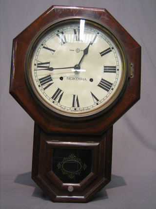 A Japanese striking wall clock the 9 1/2" circular dial marked Seikosha contained in a mahogany case