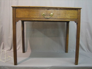 An 18th/19th Century oak side table fitted a drawer, raised on square supports 35" (split to top)