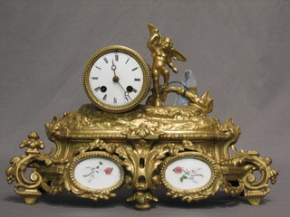 A French 19th Century striking mantel clock with enamelled dial and Roman numerals contained in a gilt spelter case