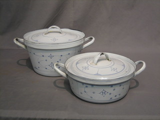 2 French enamelled circular twin handled bowls and covers 13" and 12"
