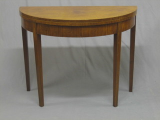 A 20th Century War Office issue Georgian style D shaped mahogany card table, raised on square tapering supports, the base dated 1949 37"