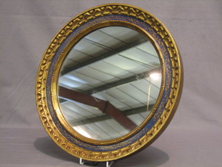 A circular bevelled plate wall mirror contained in a blue and gilt decorative frame 40" 