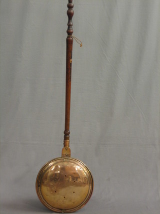 A 19th Century copper warming pan with turned fruitwood handle