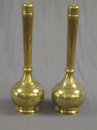 A pair of large Benares brass club shaped urns and covers with engraved decoration 27" 