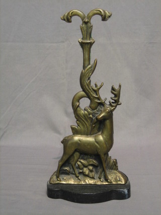 A Victorian brass and iron door stop in the form of a stag