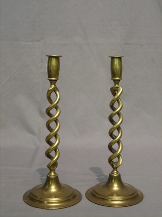 A pair of brass spiral turned candlesticks 12"