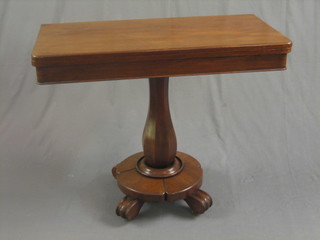 A William IV mahogany tea table, raised on a turned column with circular base and scrolled feet 36"