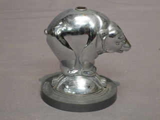 An Art Deco spirit lighter in the form of a polar bear, the base marked 1935 AMW Art metal works, 4"