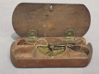 A pair of brass scales contained in a wooden case 4"