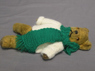 A yellow teddybear with articulated limbs 11"