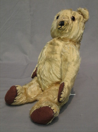 A yellow teddybear with articulated limbs 18"
