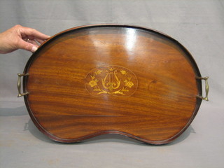 An Edwardian inlaid mahogany twin handled, kidney shaped tea tray 23" (warped)