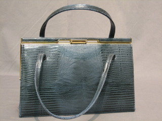 A lady's green leather handbag