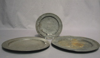 A circular pewter plate 8" and 2 other 11"