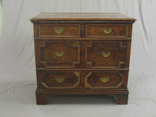 A Queen Anne oak chest of 3 long drawers with brass swan neck drop handles and with bracketed panels, raised on bracket feet 35"