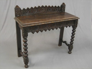 A Victorian carved oak hall table, raised on turned and block supports 39"