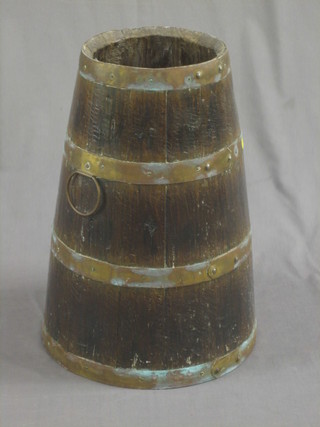 A Victorian coopered brass stick stand in the form of a barrel