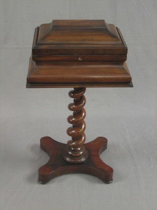 A Victorian mahogany teapoy containing twin compartment tea caddies, raised on a spiral turned column with triform base 18"