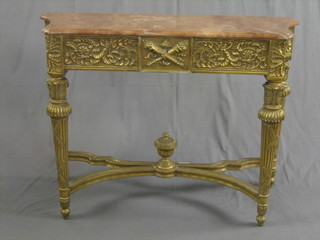 A 20th Century, 18th Century style carved gilt wood console table with pink veined marble top, raised on turned and reeded supports with X framed stretcher 47"