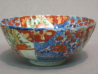 A 19th Century circular Japanese Imari porcelain bowl with lobed body and panelled decoration 9"