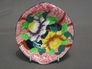A circular Malingware dish with floral decoration, base marked 65 OLA (some damage to base) 5"