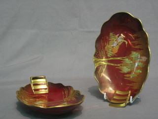 A pair of Carltonware Rouge Royal boat shaped dishes decorated storks amidst trees 8 1/2"