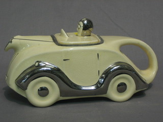 A Sadler style white glazed teapot in the form of a 1930's racing car, the base marked Made in England Registered 820236 (crazing to body and slight firing crack to head?), number plate reads OKT 42