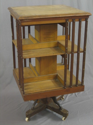 An Edwardian square oak revolving bookcase "The American Patent Revolving Bookcase" manufactured by Trubner & Co Ludgate Hill London 23"