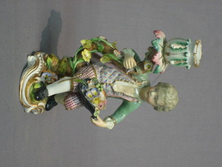 A Samson porcelain candlestick in the form of a seated boy 6"