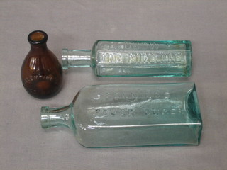 A brown glass bottle for Valentine's meat juice 3", a clear glass bottle for Finnigin's Feaver Cure 6", and a clear glass bottle for Benbow's Dog Mixture 6"