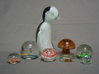 A paperweight in the form of a standing penguin 9", a Wedgwood amber glass paperweight in the form of a mushroom 3" and 6 other paperweights