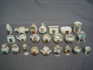 23 items of Goss Crested china - a model of a Stowp with Arms of Rhayader, an old Spanish jug with Arms of Plymouth, a pineapple Arms of Bournemouth, a vase Arms of Dorking, a Jersey fishing basket Arms of Paddington, an Ancient kettle Arms of Hastings, a Pipkin Arms of Southampton, a Roman ewer with The Farmers Arms, an Ancient bronze kettle Arms of Conway, a ewer Arms of Littlehampton, an Ancient Irish bronze pot Arms of Wendover, a Swiss cow bell Arms of Isle of Wight, a Highland Cuach Arms of Sheffield, an Old Manx pot Arms of Ruthin, an Ancient Egyptian bowl Arms of Middelburgh, an old Terra Cotte kettle Arms of Barnsley, an ancient salt pot Arms of Wisbech, an ancient cupboard jarr Arms of Leatherhead, a Welsh milk can Arms of Swindon, a beaker Arms of Bournemouth, an Ancient Tyg Arms of Suffolk, an Abbqt Beeres Jack Arms of Cartmel Priory and an Ancient urn Arms of Trinity Hall