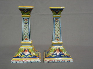 A pair of square faience candlesticks, the bases marked XE17 8"
