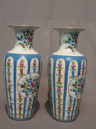 A pair of 20th Century Sevres style porcelain vases with green and gilt decoration 14" 