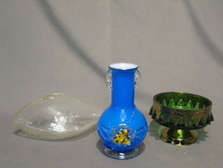 A blue club shaped twin handled vase 8", a green glass pedestal bowl 6" and a boat shaped glass ornament 9"