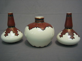 A garniture of 3 Edwardian pottery vases with 2 club shaped vases and a globular shaped vase 7"