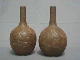 A pair of Victorian club shaped Eathernware vases with stylised decoration 11"