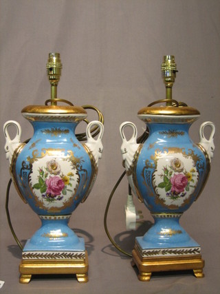 A pair of 19th Century style porcelain twin handled urns 13"