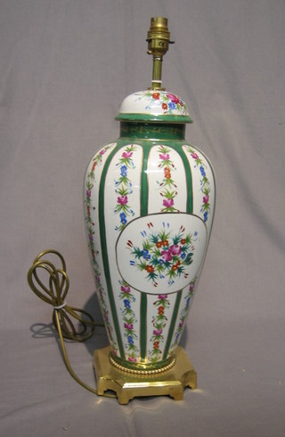 A French style porcelain table lamp in the form of an urn with floral decoration 19"