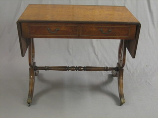 A Georgian style mahogany sofa table fitted 2 drawers and raised on lyre supports with turned stretcher 34"