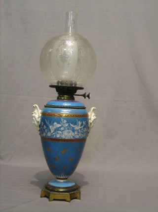 A Victorian Minton blue glazed twin handled oil lamp reservoir with etched glass shade and clear glass chimney 25"