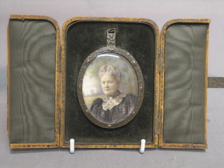 H Everard Winter, a portrait miniature on ivory "Lady" contained in a copper oval frame 2", complete with leather travelling case